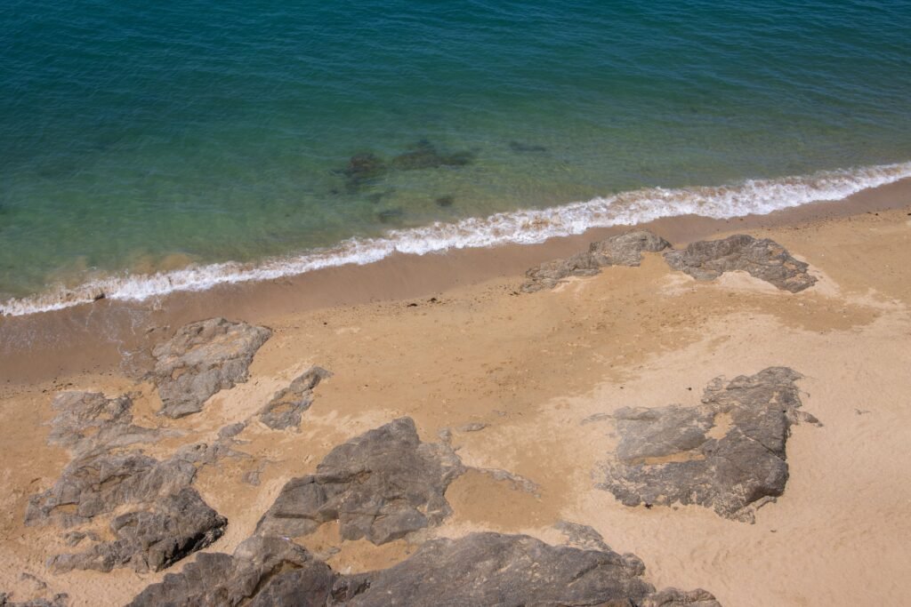 A tranquil sandy beach with rocky formations at Saint-Malo, Brittany, France.